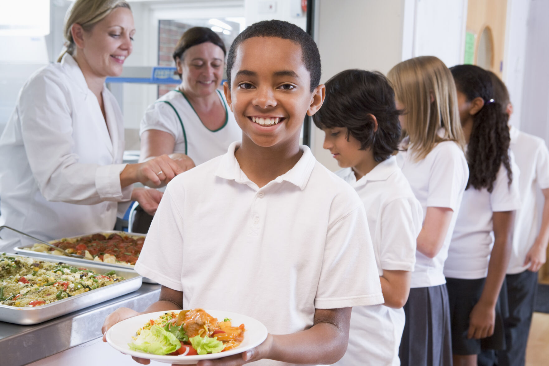 Student holding plate of food